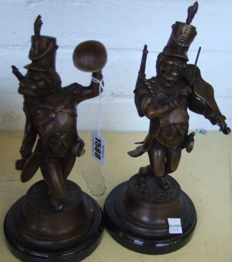 Appraisal: A pair of modern bronze military band figures raised on