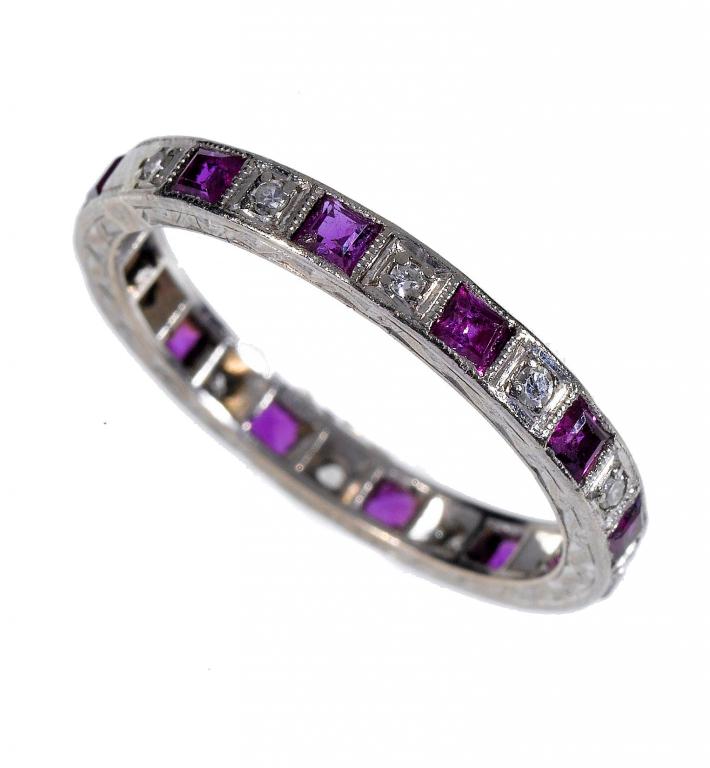 Appraisal: A RUBY AND DIAMOND ETERNITY RING the calibr cut rubies