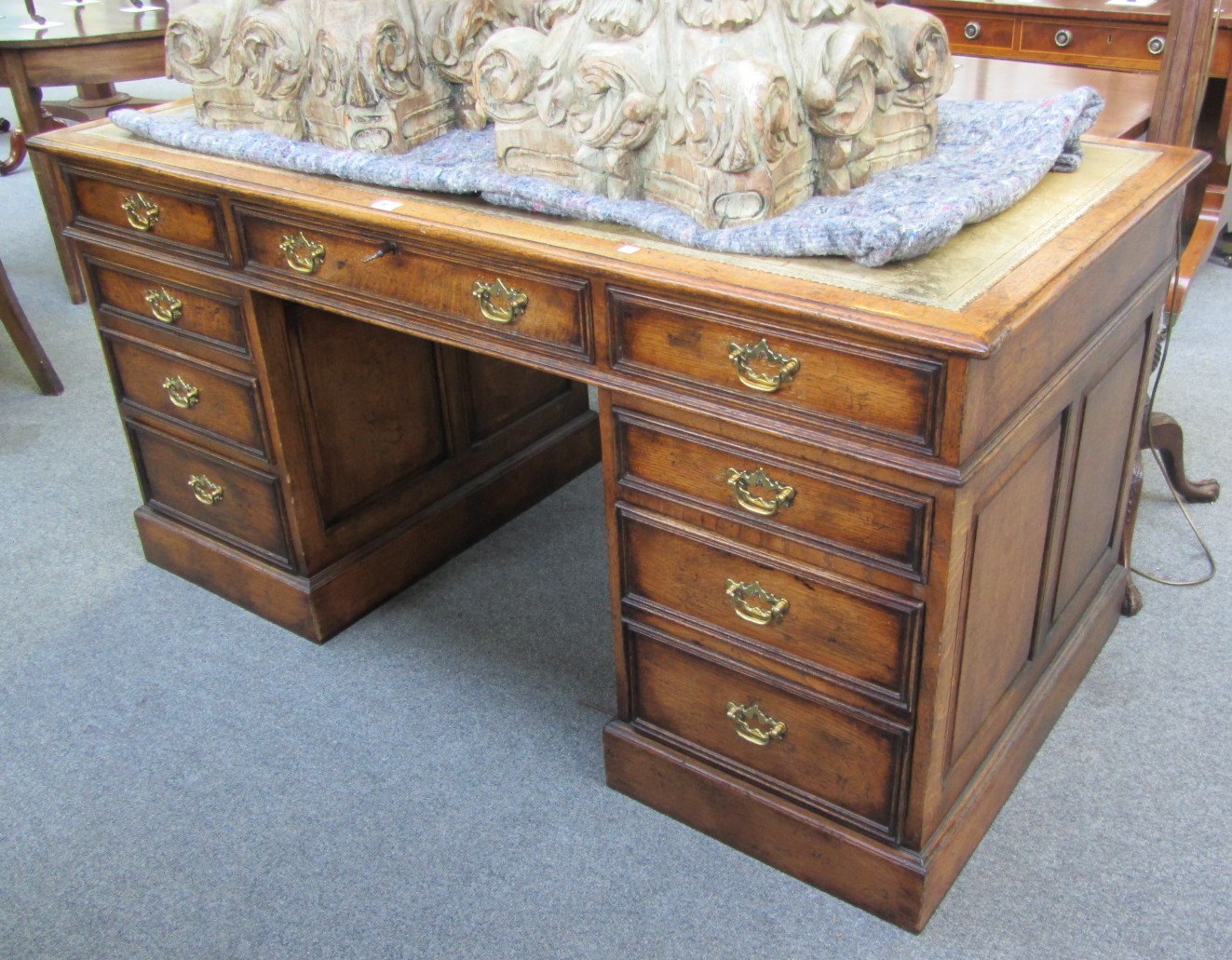 Appraisal: An th century style oak pedestal writing desk with eight