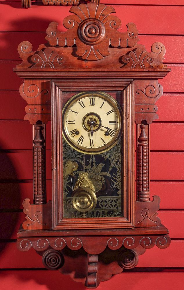 Appraisal: AN UNIDENTIFIED FANCY HANGING CHERRY PARLOR CLOCK The elaborate scroll