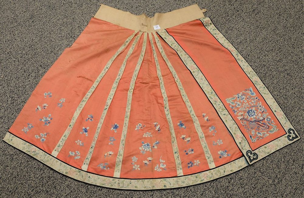 Appraisal: Chinese silk skirt red ground embroidered with blue flowers length