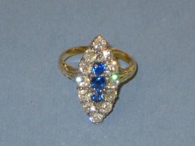 Appraisal: A SAPPHIRE AND DIAMOND RING of navette form having three