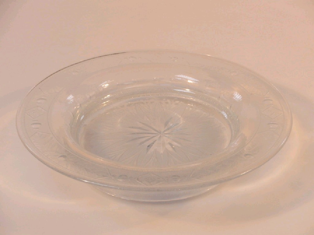 Appraisal: A circular glass stand with broad rim etched with finely