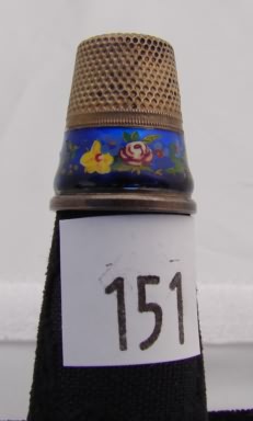 Appraisal: Silver tone thimble with blue enamel band