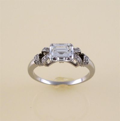 Appraisal: An emerald cut diamond solitaire ring the diamond weighs carats