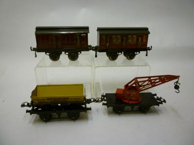 Appraisal: Hornby four wheel passenger coach in L M S red