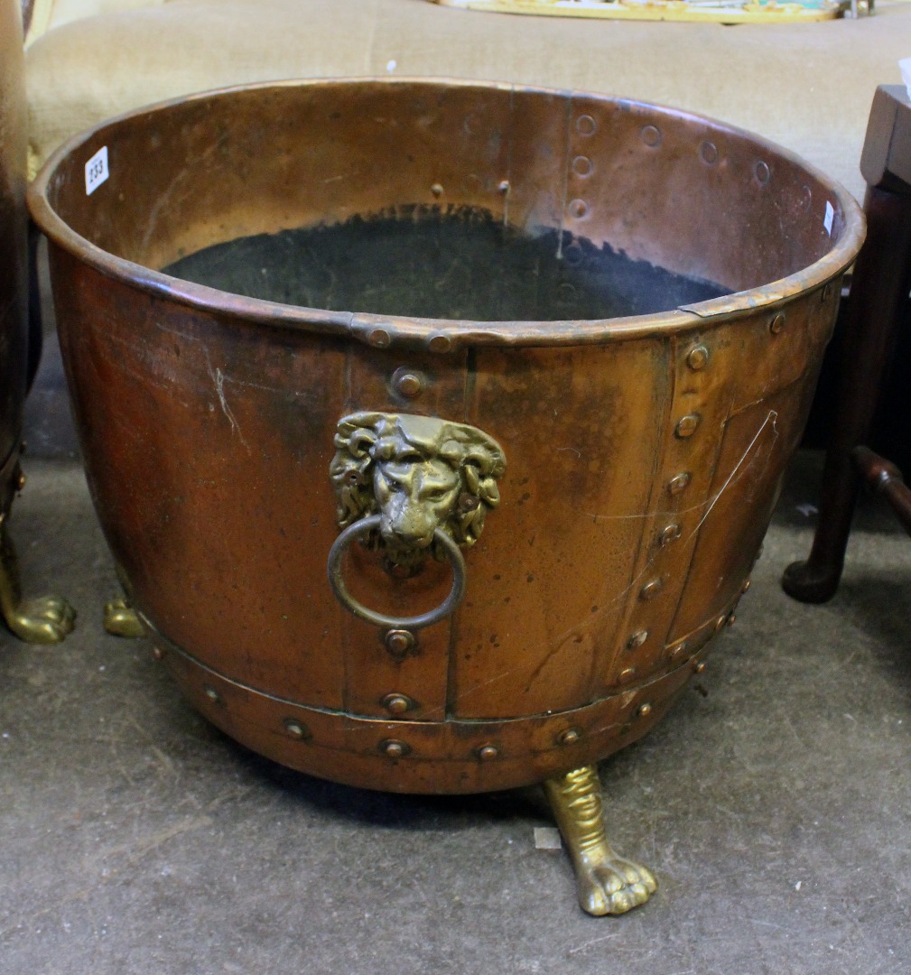 Appraisal: A large copper cistern for logs with studded bands brass