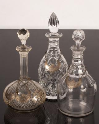 Appraisal: Three cut glass decanters with three plated wine labels and