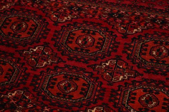 Appraisal: ORIENTAL RUG Ca Turkoman Shades of burgundy dark blue and