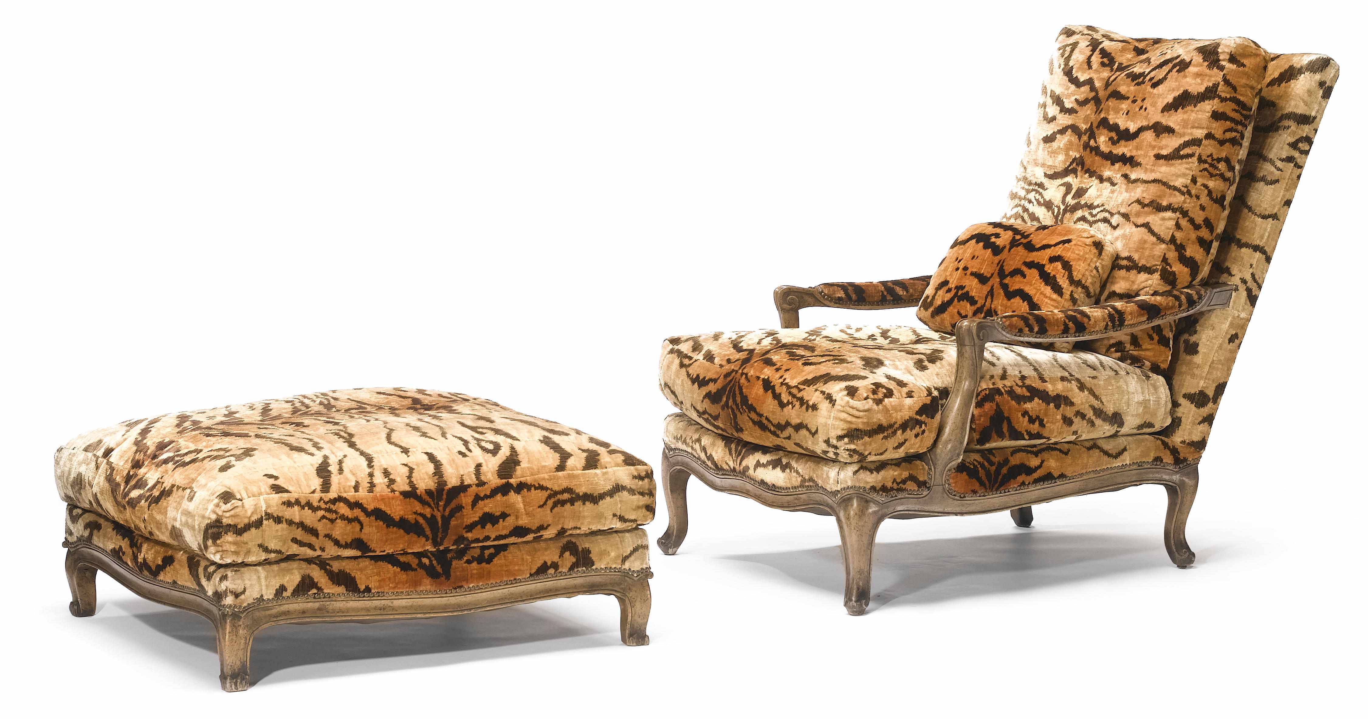 Appraisal: An imposing Louis XV style mixed wood fauteuil and tabouret