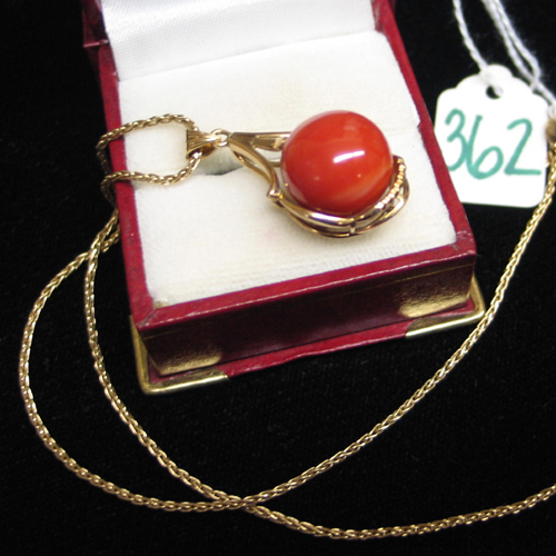 Appraisal: RED CORAL AND FOURTEEN KARAT GOLD PENDANT NECKLACE set with