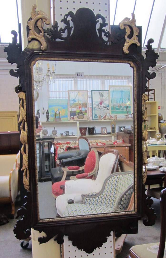 Appraisal: A mahogany parcel gilt fret cut wall mirror cm high