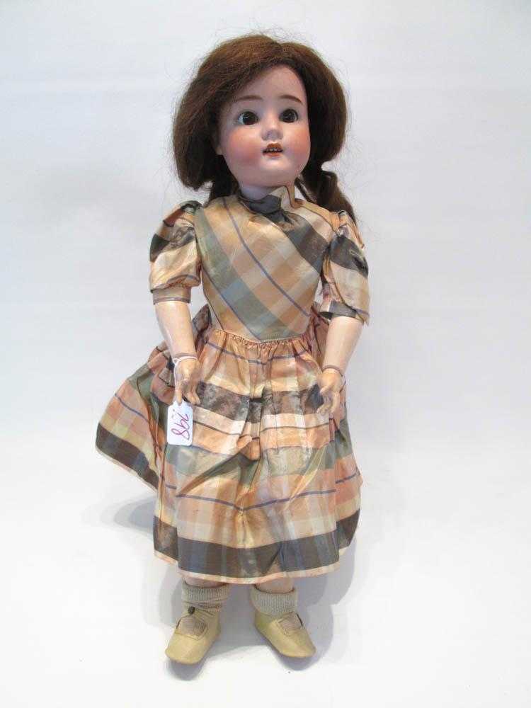 Appraisal: GERMAN GUTTMAN SCHIFFNIE CHILD BISQUE HEAD DOLL socket head brown