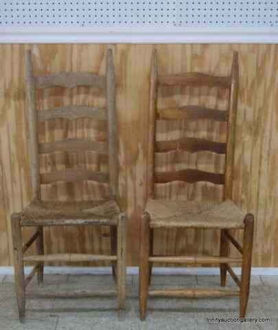 Appraisal: Pair of Oak Ladder Back Rush Bottom ChairsThis is vintage