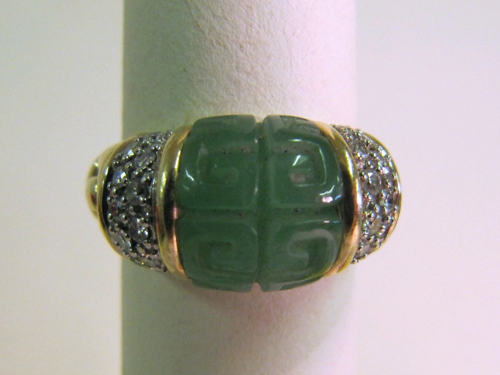 Appraisal: Fourteen carat bi colour gold carved jade and diamond set