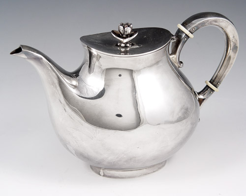 Appraisal: STERLING TEAPOT Hinged lid with rose form finial Bone rings