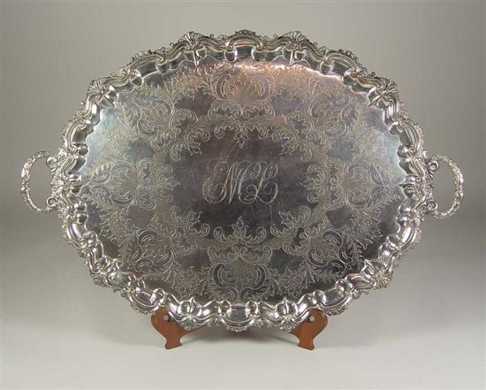 Appraisal: Footed Silverplate Tray Circa Heavy fluted tray with handles and