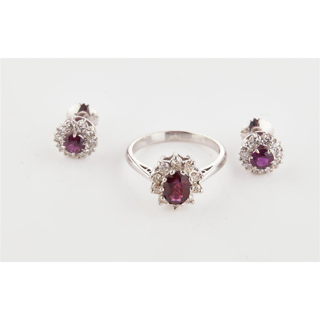 Appraisal: A ruby and diamond cluster ring and earrings the ring