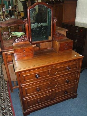 Appraisal: A Victorian mahogany dressing chest of three long drawers and