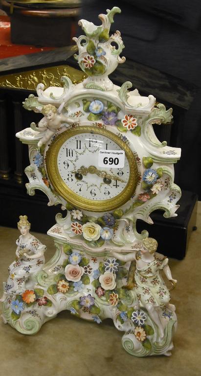 Appraisal: French porcelain two train mantel clock the movement striking on