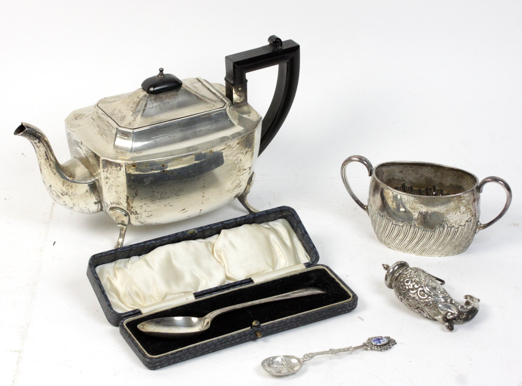 Appraisal: A silver teapot Birmingham an oval two-handled sugar basin Sheffield