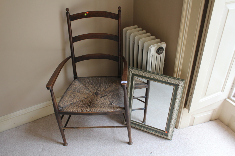 Appraisal: A rush seated beech ladderback chair and modern rectangular framed