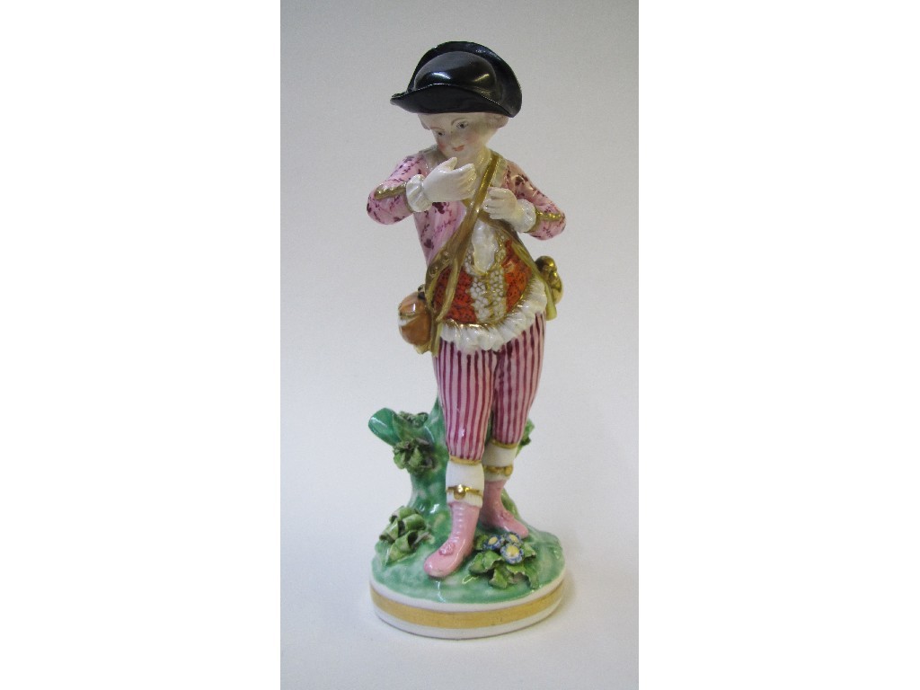 Appraisal: A Derby figure of a boy standing and wearing floral