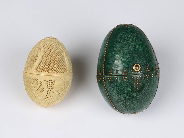 Appraisal: A CONTINENTAL CARVED IVORY PIERCED AND THREADED EGG with bird