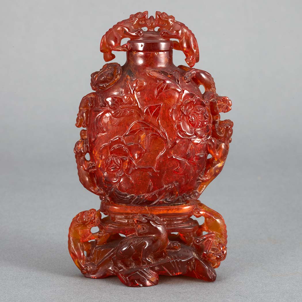 Appraisal: Chinese Amber Snuff Bottle Early th century The compressed ovoid