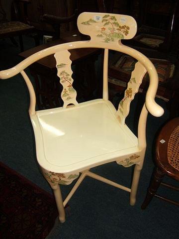 Appraisal: An Oriental white lacquered corner open arm chair decorated with