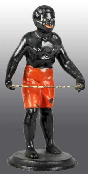 Appraisal: Cast Iron African American Figure Description Man is holding a