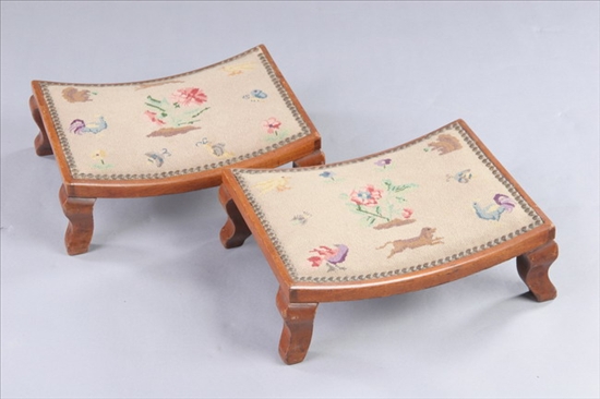 Appraisal: PAIR NEEDLEPOINT UPHOLSTERED LIGHT MAHOGANY CONCAVE RECTANGULAR FOOTSTOOLS th century