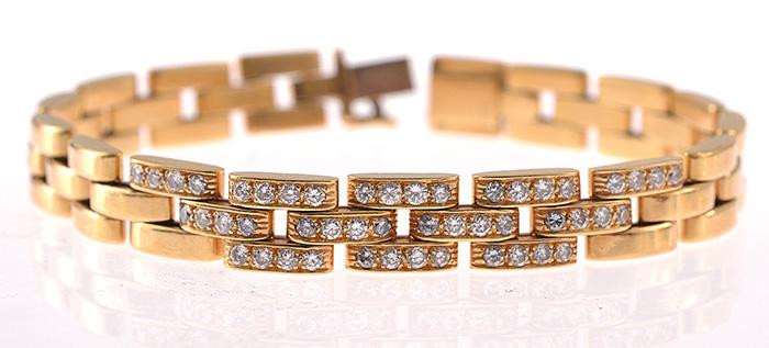 Appraisal: A DIAMOND PANTHERE BRACELET BY CARTIER Featuring central links set