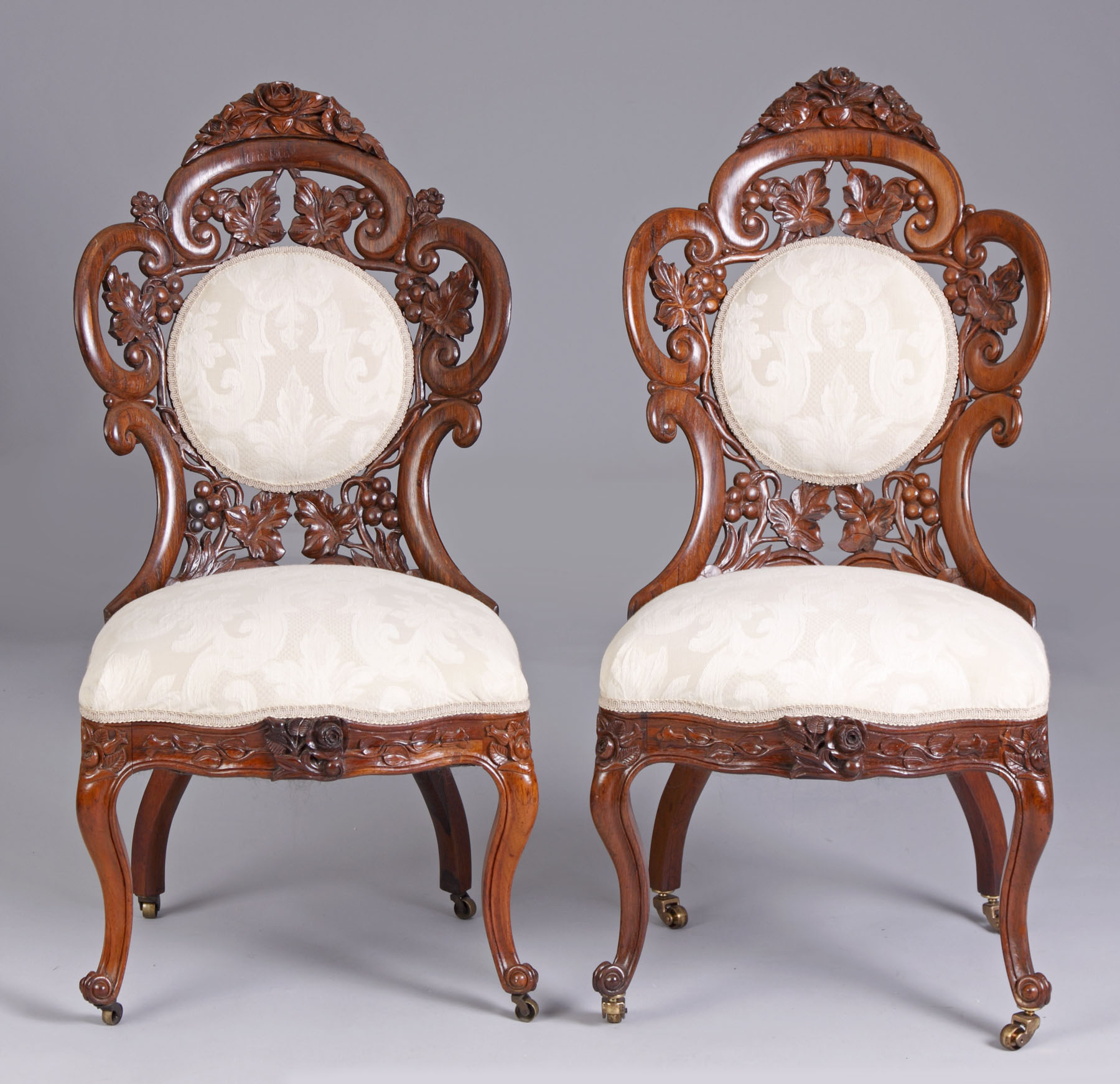 Appraisal: Pair of Belter Fountain Elms Side Chairs Pierce carved laminated