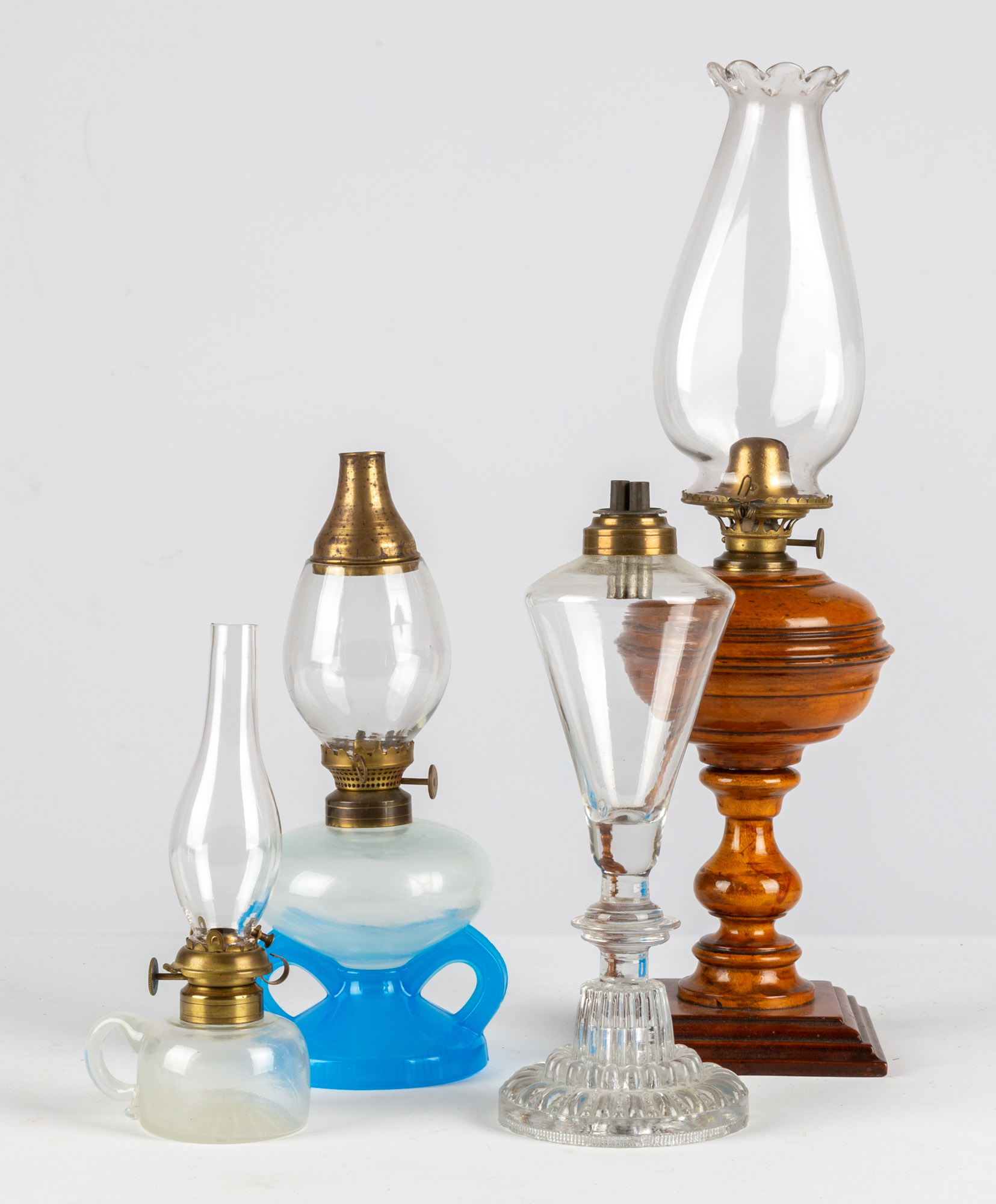 Appraisal: OIL WHALE OIL LAMPS - wood and glass period burners