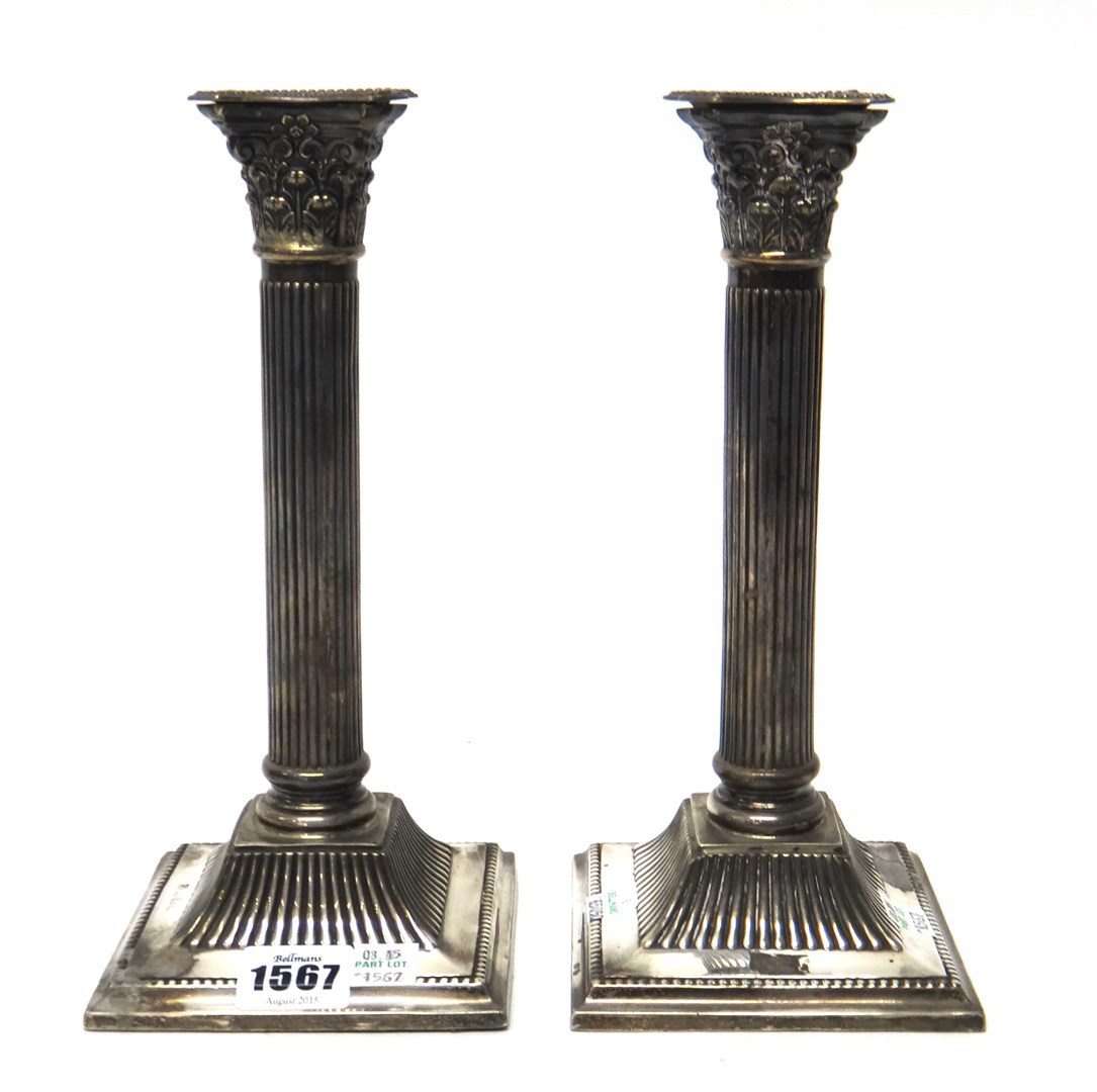 Appraisal: A pair of silver table candlesticks each of Corinthian column