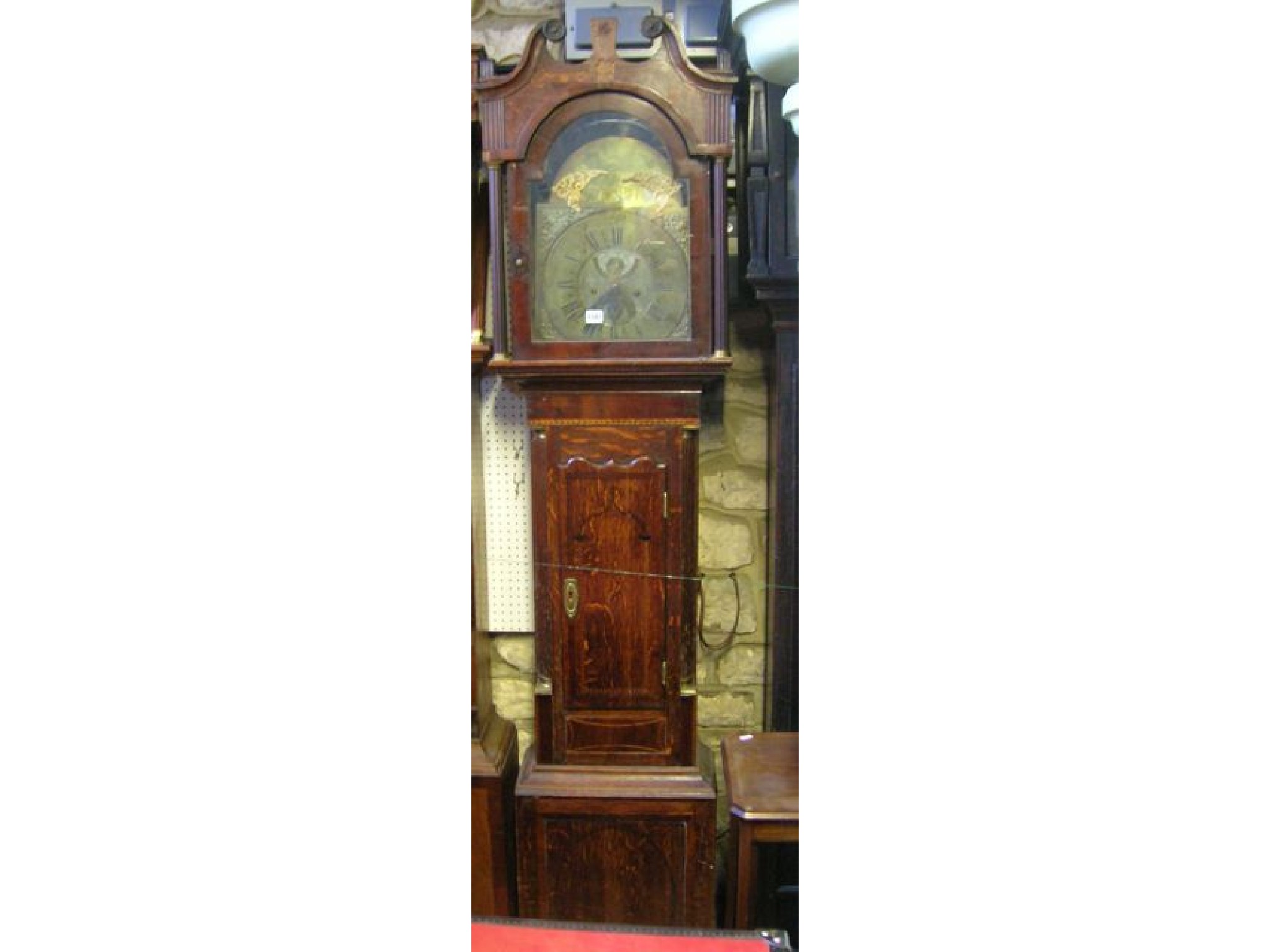 Appraisal: A Regency oak longcase clock with inlaid detail the hood