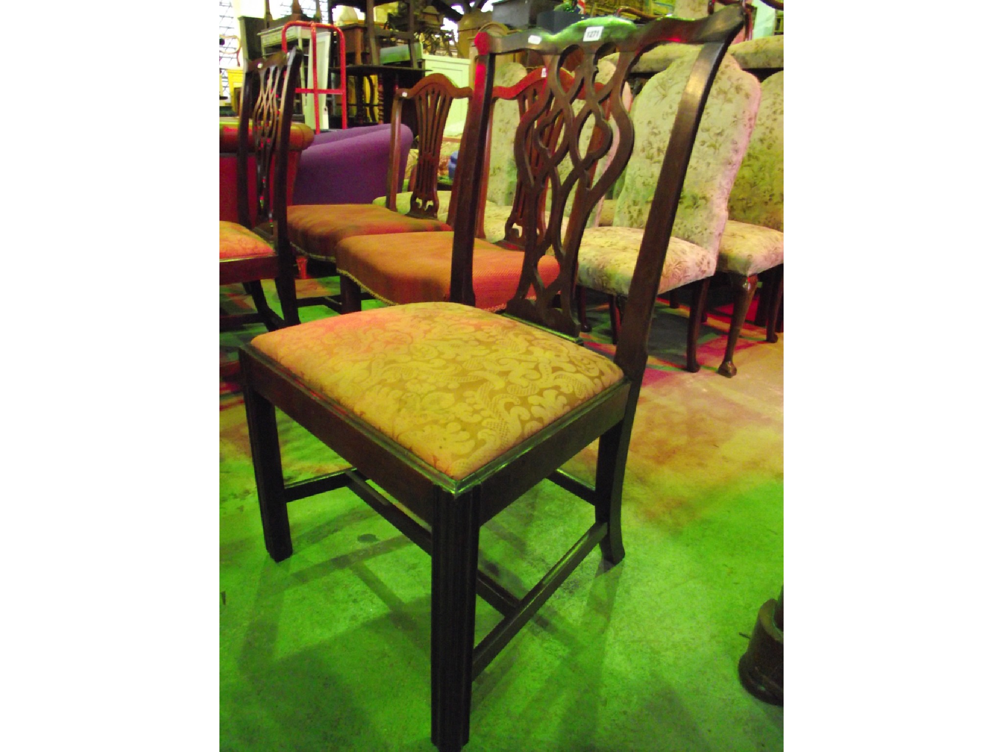 Appraisal: A pair of Georgian mahogany dining chairs in the Chippendale