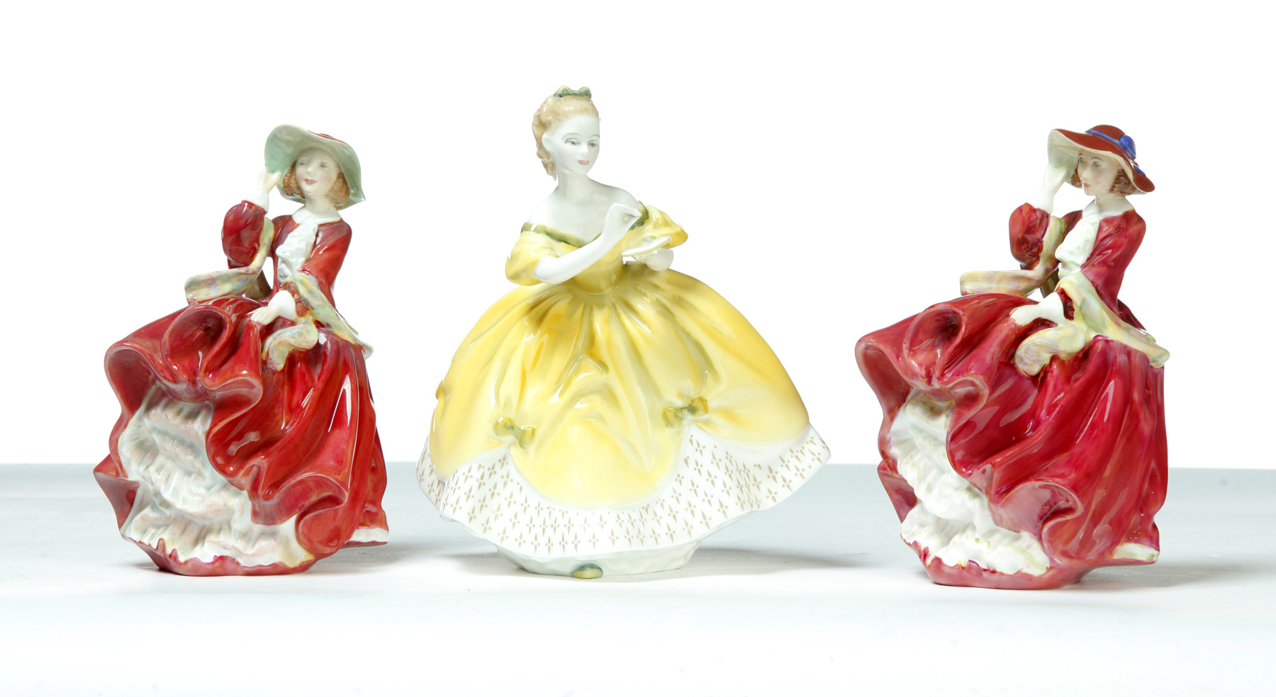 Appraisal: THREE ROYAL DOULTON LADY FIGURINES England th century Characters include