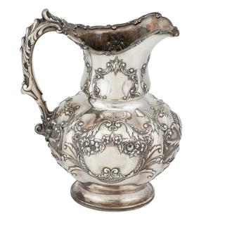 Appraisal: GORHAM STERLING SILVER REPOUSSE WATER PITCHER Adorned with scroll and