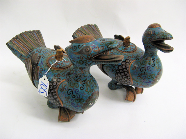 Appraisal: PAIR OF CLOISONNE STYLIZED MUSCOVY DUCKS in opposing positions ornately