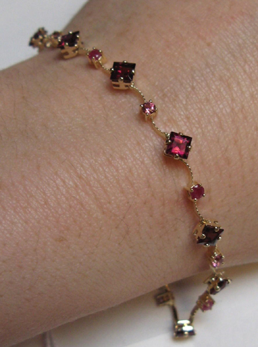 Appraisal: GARNET RUBY AND FOURTEEN KARAT GOLD BRACELET eight inches in