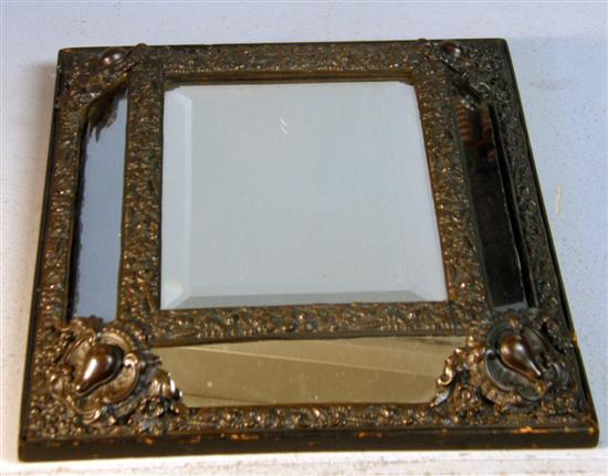 Appraisal: th century brass cushion shaped wall mirror the frame embossed