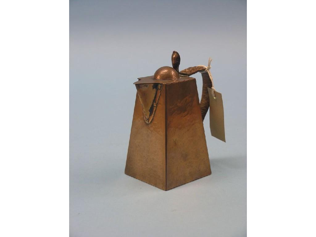 Appraisal: A Newlyn copper hot water jug square tapering shape with