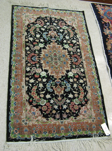 Appraisal: A PAIR OF ORIENTAL SILK WOOL AREA RUG both hand