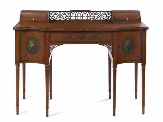 Appraisal: An Edwardian Ladies' Writing Desk the shaped rectangular top fitted