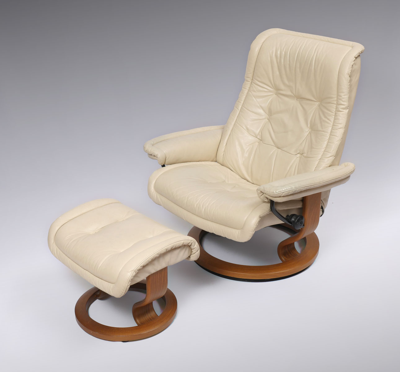 Appraisal: STRESSLESS RECLINER AND OTTOMAN White leather upholstered adjustable recliner ottoman