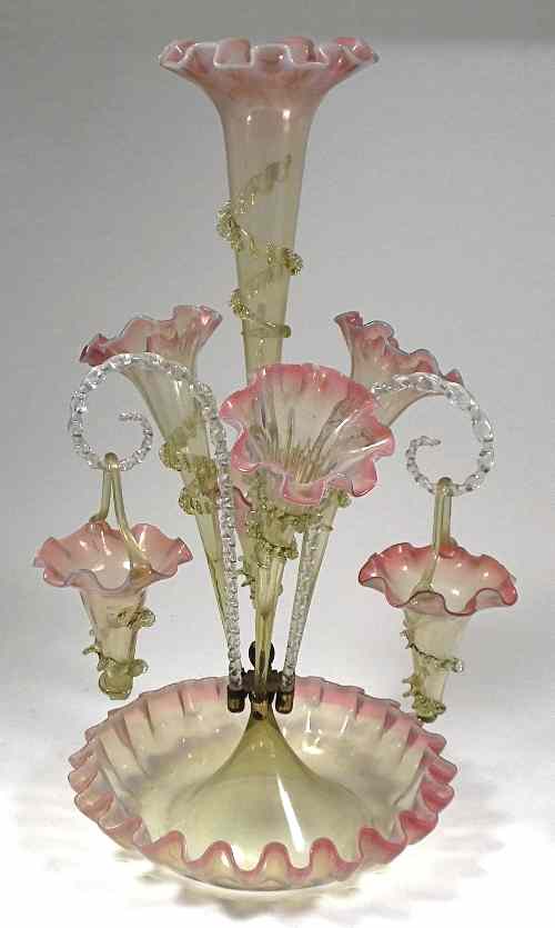 Appraisal: A Victorian pale green and ruby tinted glass epergne with