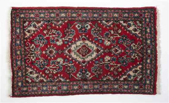 Appraisal: A Northwest Persian Wool Mat having a central medallion within