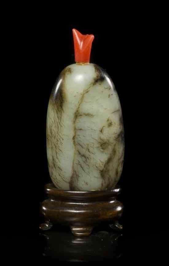 Appraisal: A Pebble Form Jade Snuff Bottle of celadon colored stone